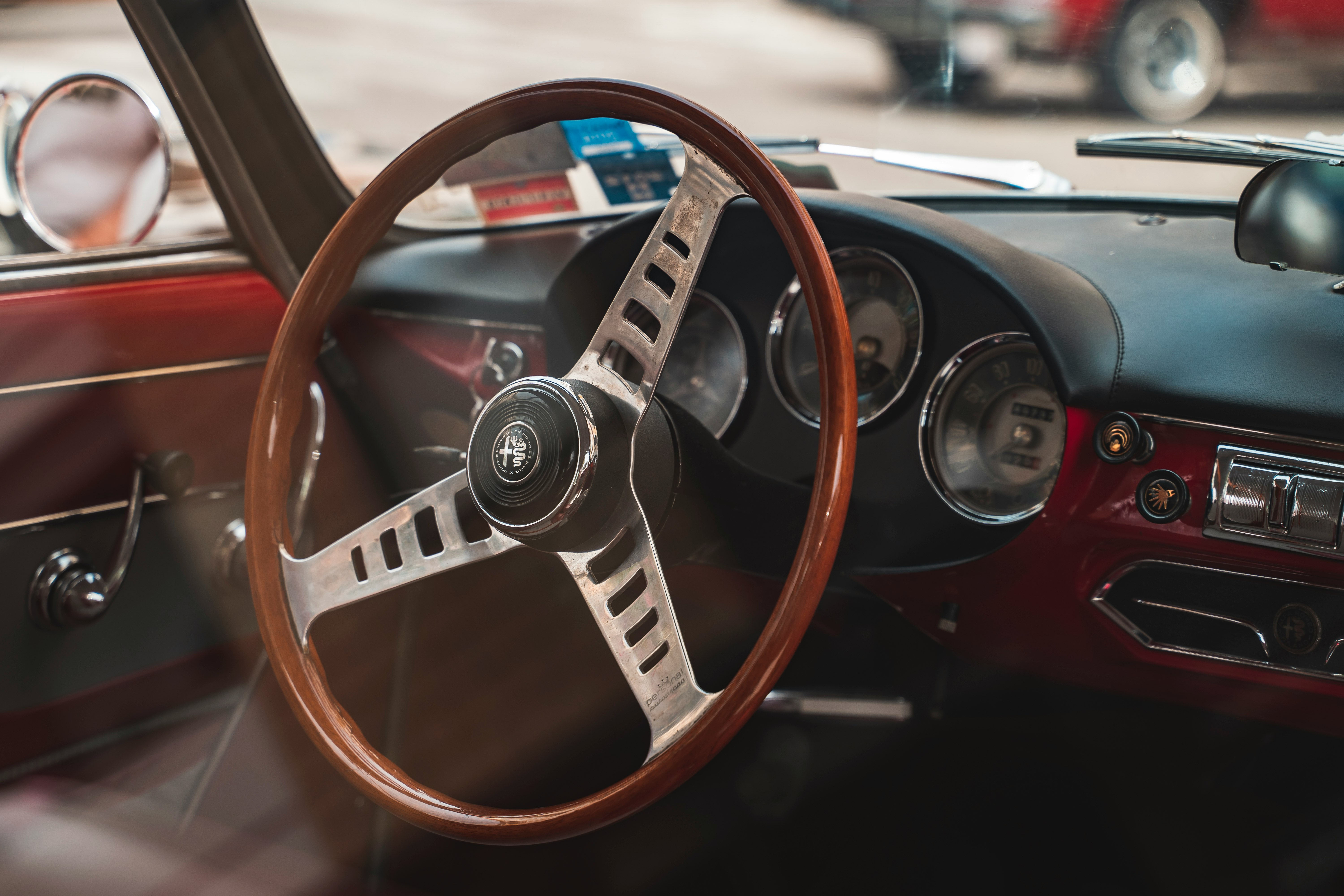 red and black car steering wheel